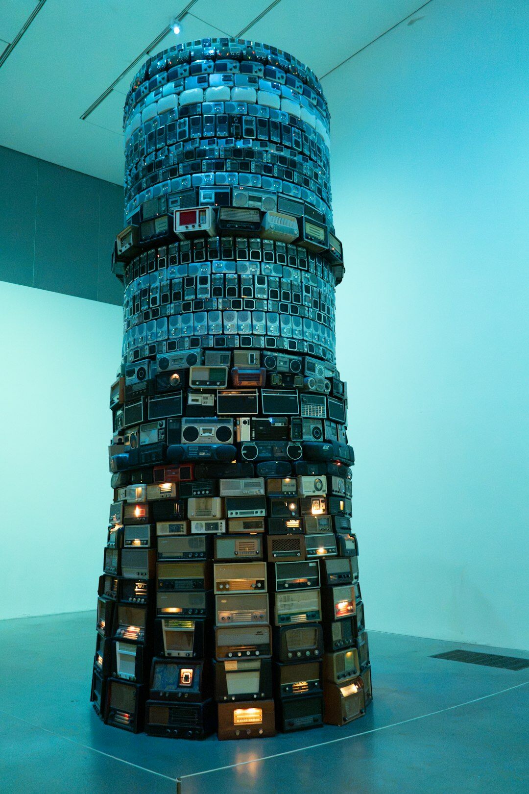 Stack of old vintage television sets in a museum display